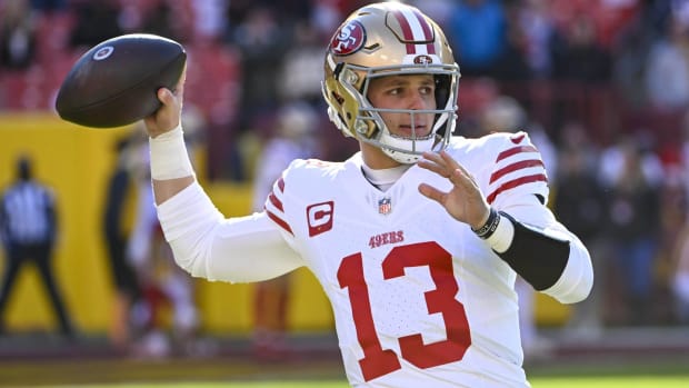 49ers quarterback Brock Purdy throws a pass in warmups before a game.